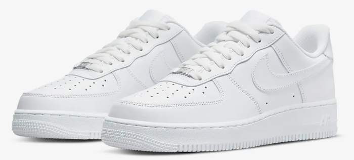 Side view of white Nike sneakers.